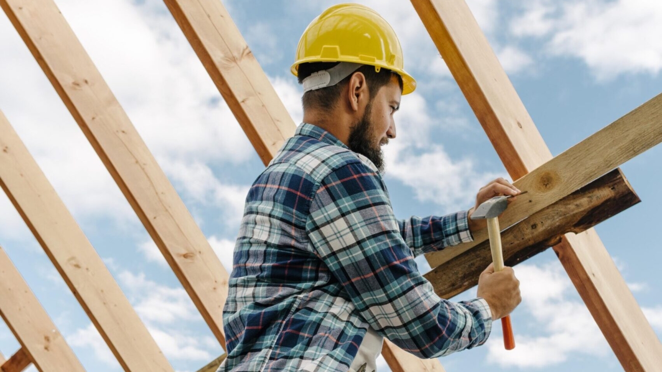 construction-worker-with-hard-hat-building-roof-house