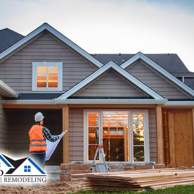 male professional contractor performing expert residential home remodeling service by construction a professionally designed home addition to exterior