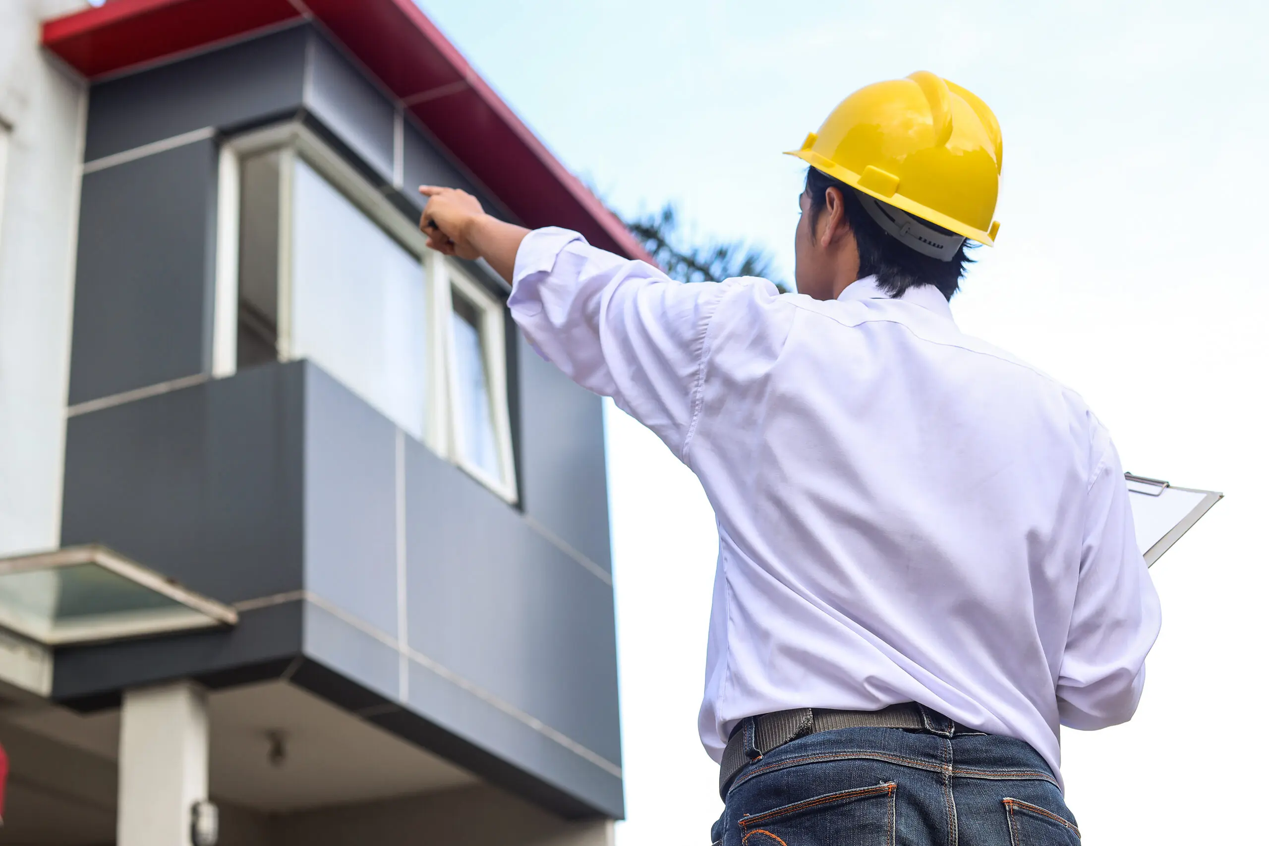 rear-view-of-construction-engineer-check-plan-work-2025-01-28-03-04-08-utc