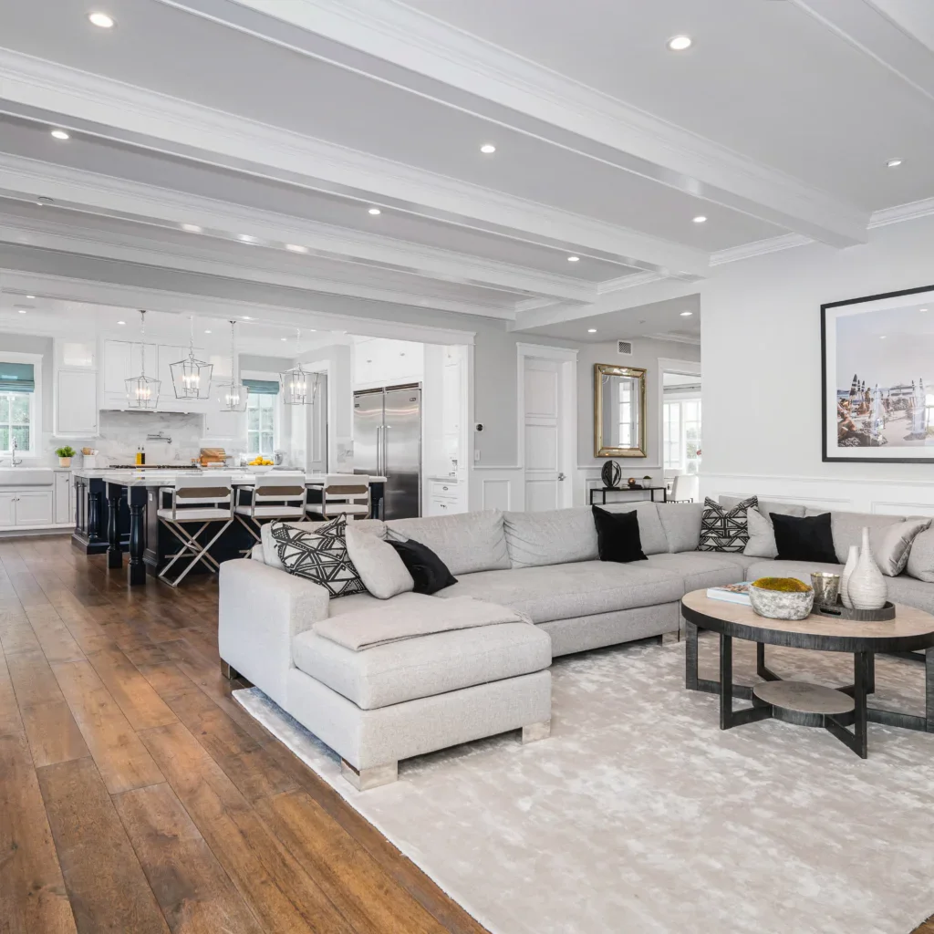 Modern open concept living room and kitchen with light gray and white decor
