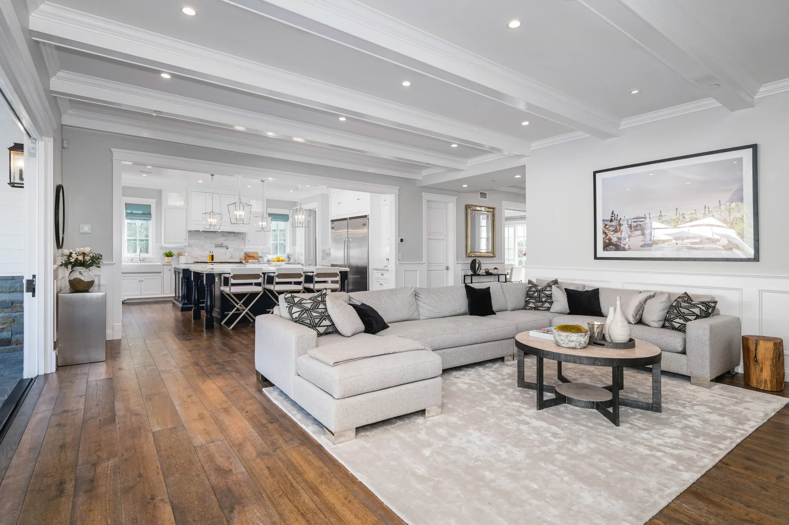 Modern open concept living room and kitchen with light gray and white decor